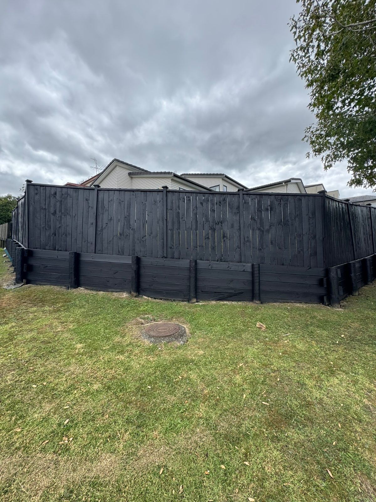 Fence and retaining wall after painting