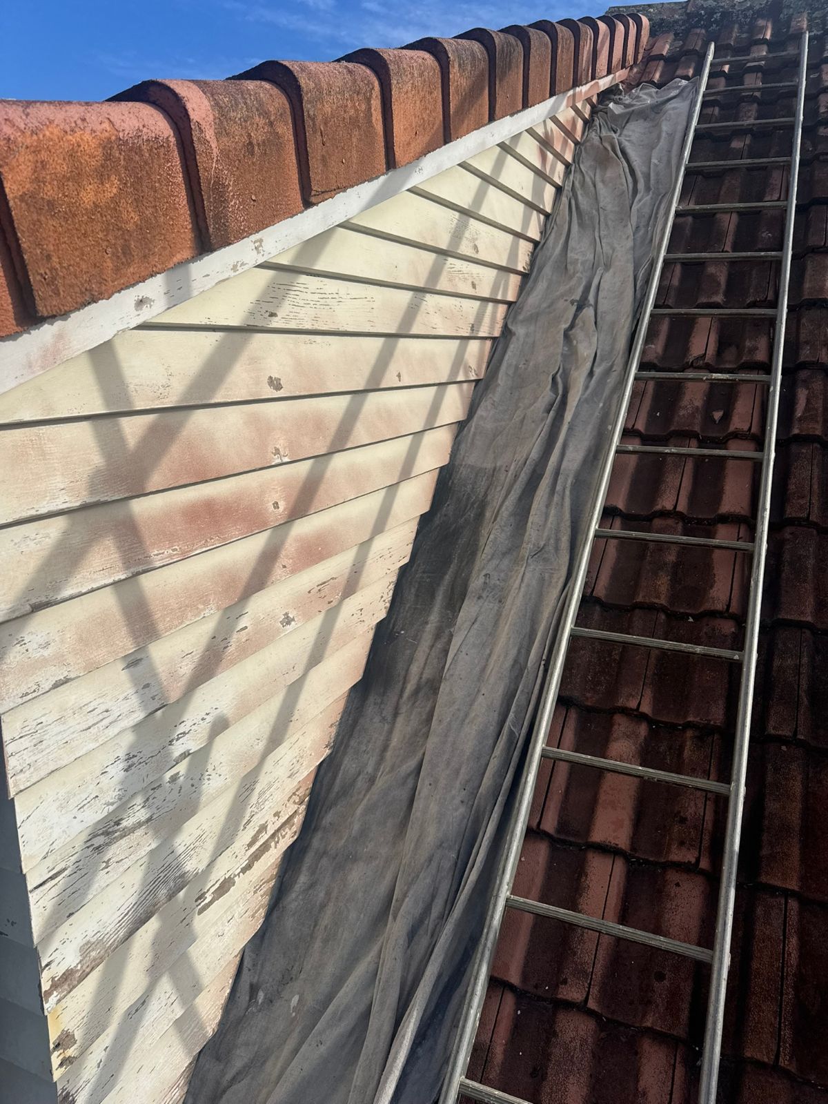 Weathered weatherboard cladding before painting